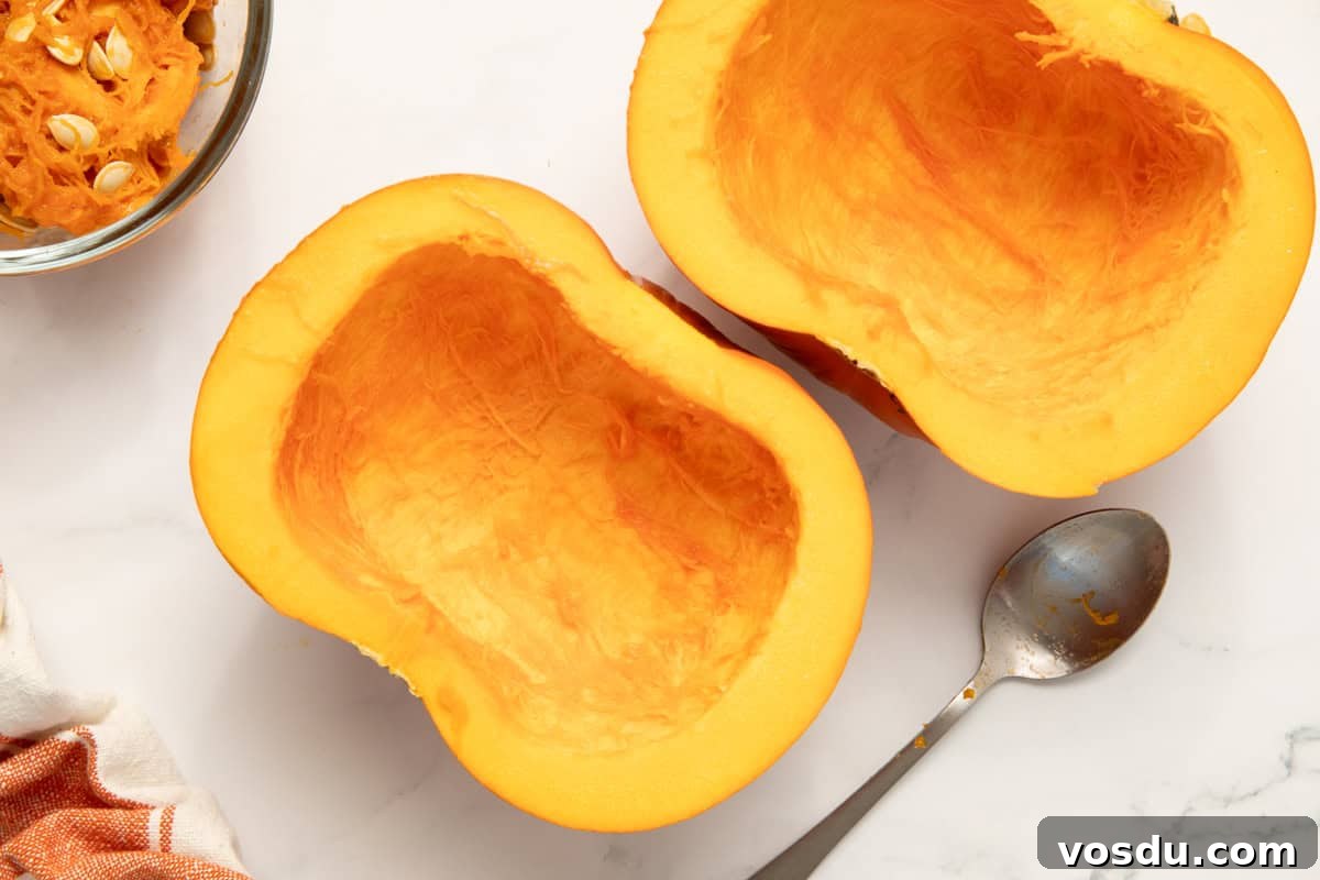 Homemade Pumpkin Puree From Scratch — Step-by-Step Recipe 4 a pie pumpkin cut in half with the seeds scraped out