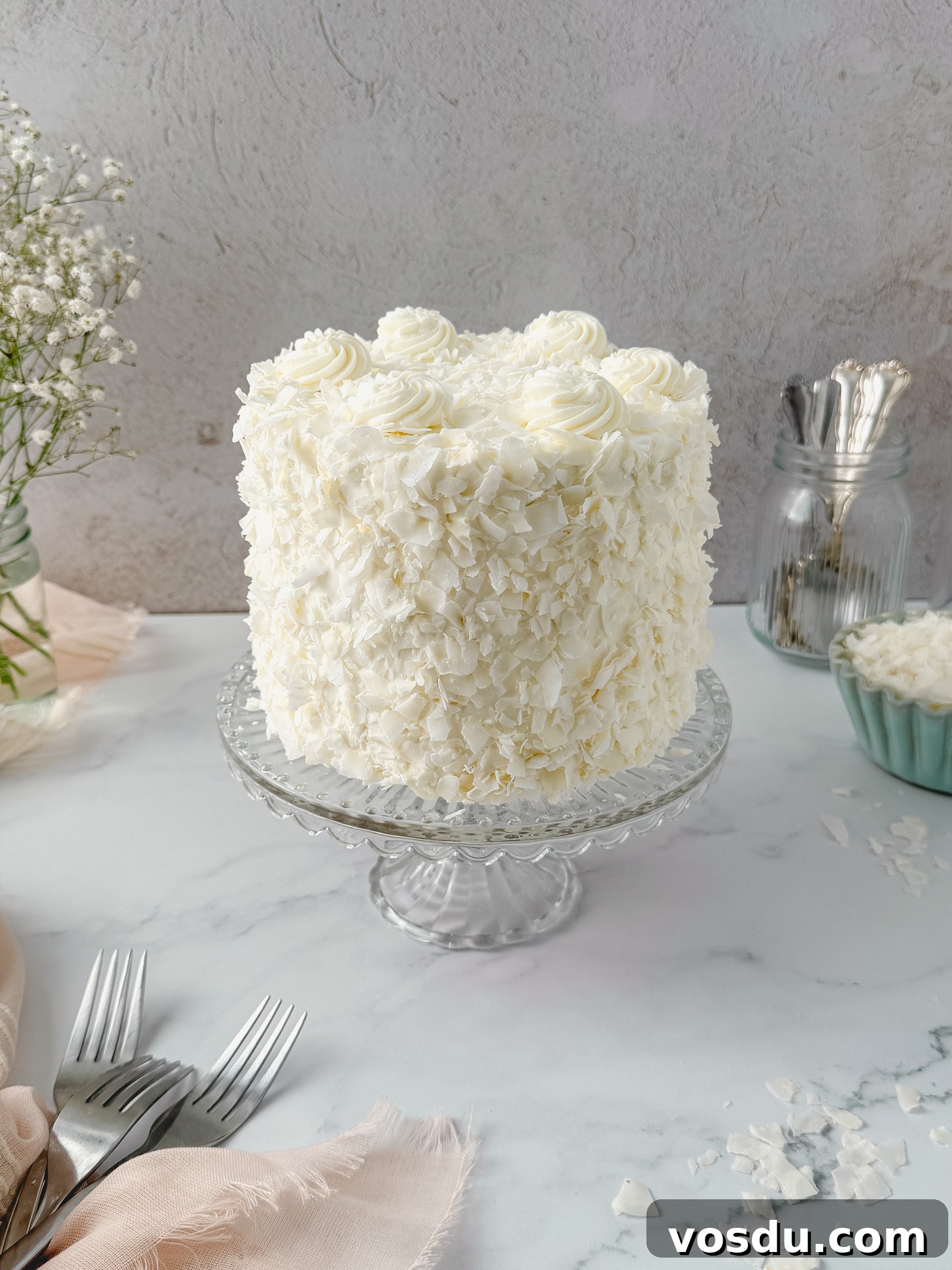 Coconut Layer Cake Recipe with Creamy Coconut Frosting 7 Close up coconut flakes
