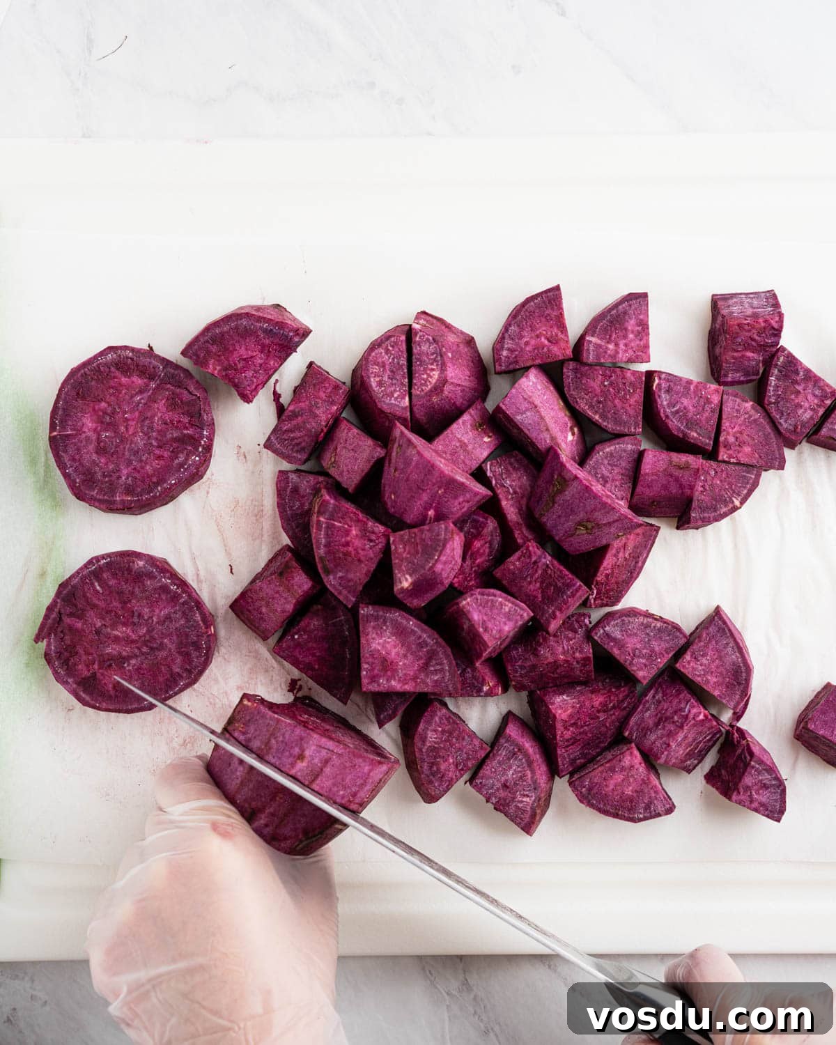 Homemade Ube Halaya (Purple Yam Jam) 4 cutting purple yam into cubes.