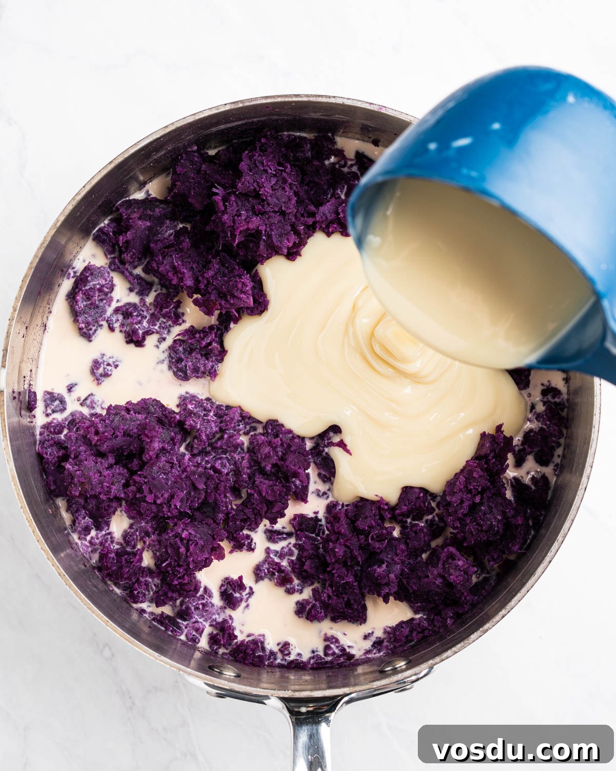 Homemade Ube Halaya (Purple Yam Jam) 7 adding condensed milk and evaporated milk with mashed purple yam.