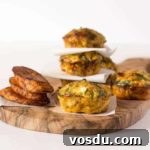 a pile of plantain frittata sitting on a cutting board separated by paper