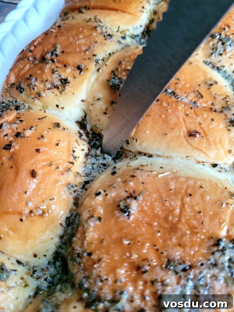 Italian Hawaiian Mini Roll Sliders Recipe 9 Piercing intersections of Hawaiian roll sandwiches with a fork to let buttery herby flavor soak in.
