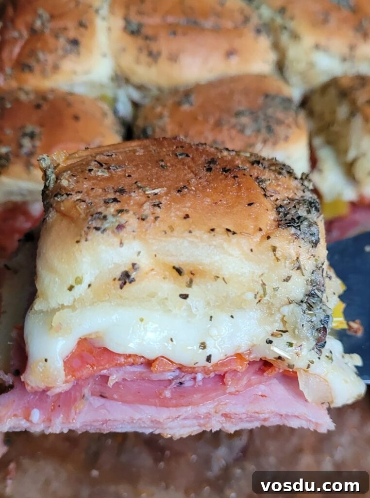 Italian Hawaiian Mini Roll Sliders Recipe 10 Golden, baked quick baked sliders with Parmesan topping, fresh from the oven.