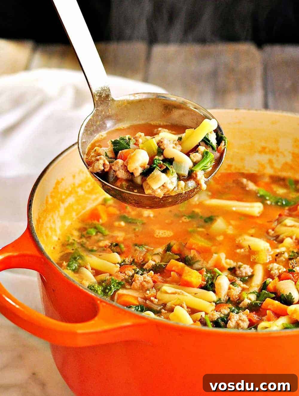 Classic Pasta e Fagioli: Hearty Italian Pasta and Bean Soup 2 Pasta e Fagioli being served from a ladle