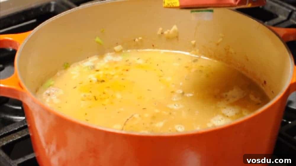 Classic Pasta e Fagioli: Hearty Italian Pasta and Bean Soup 6 Adding Broths