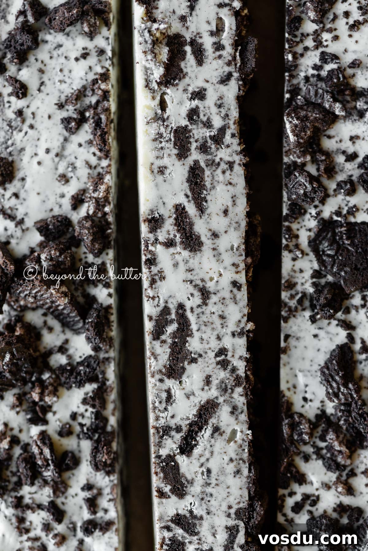 Cookies and Cream Fudge Recipe: Rich No-Bake Dessert Guide 7 Bars of cookies and cream fudge on brown parchment paper | All Images © Beyond the Butter®