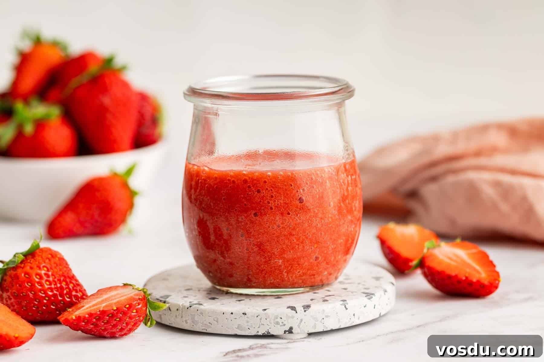 Decadent Homemade Strawberry Sundae Recipe 8 Small week jar with fresh strawberry sauce in it.