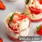 Decadent Homemade Strawberry Sundae Recipe 10 Two glass mugs full of a strawberry sundae.