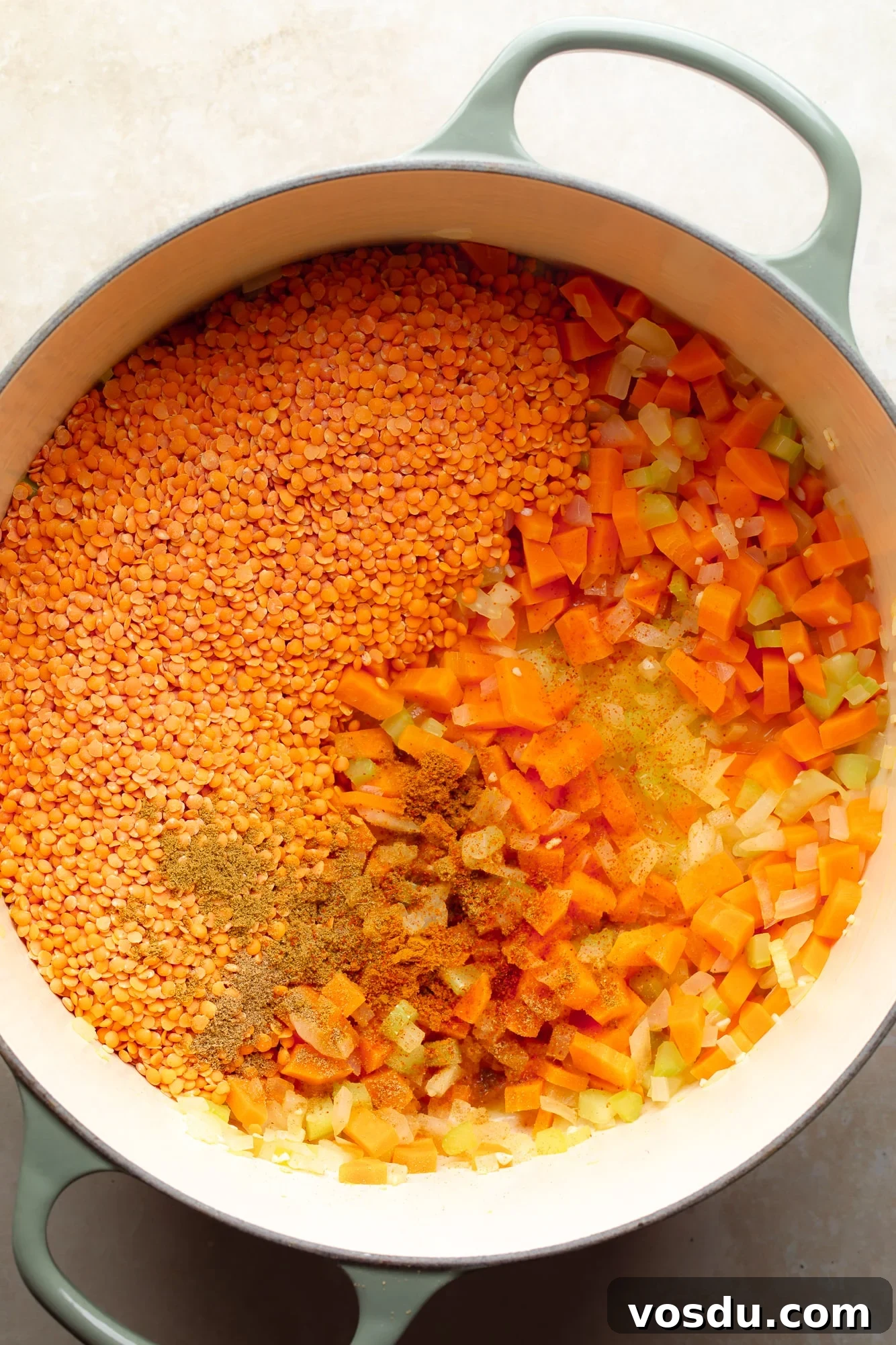 Zesty Lemon Lentil Soup Recipe for Bright, Comforting Meals 4 overhead view of the ingredients for lemon lentil soup in a large pot.