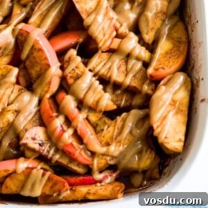 Baked Apple Slices with Homemade Caramel Sauce 15 A pan filled with baked apple slices topped with a caramel sauce.