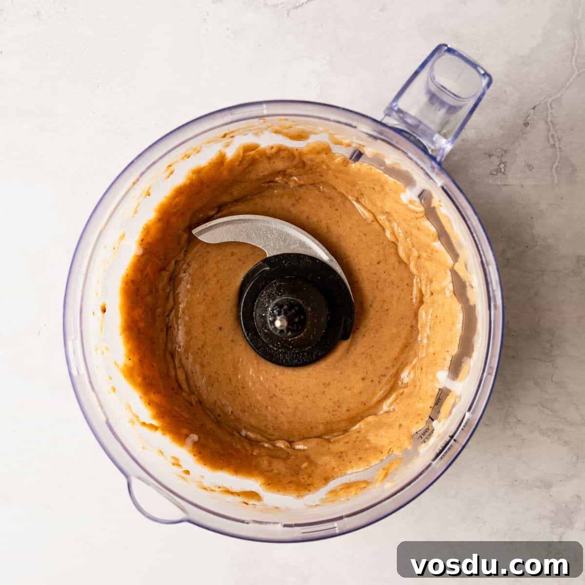 Baked Apple Slices with Homemade Caramel Sauce 8 A blender filled with a caramel sauce.