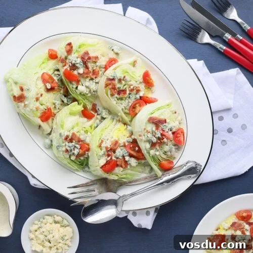 bacon and tomato wedge salads arranged on a white platter