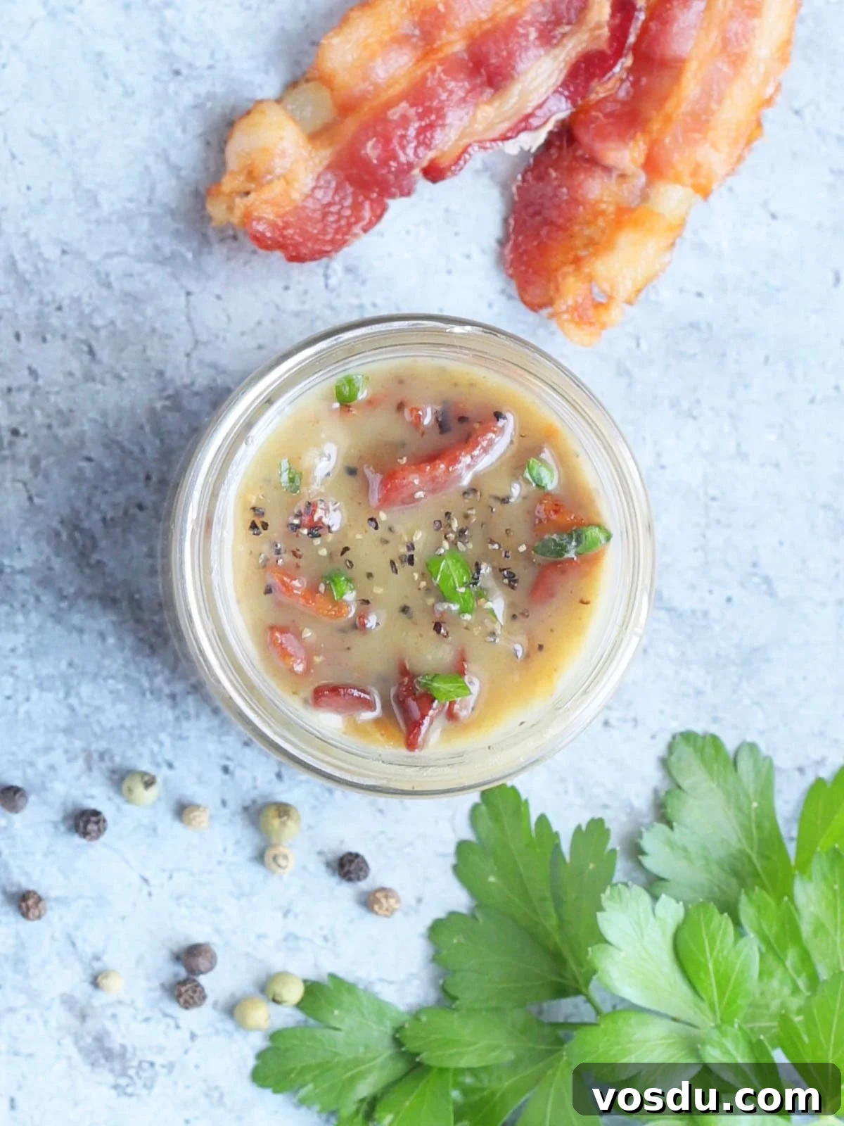 Savory Warm Bacon Vinaigrette for Salads and Vegetables 10 Looking down into a jar of hot bacon dressing.