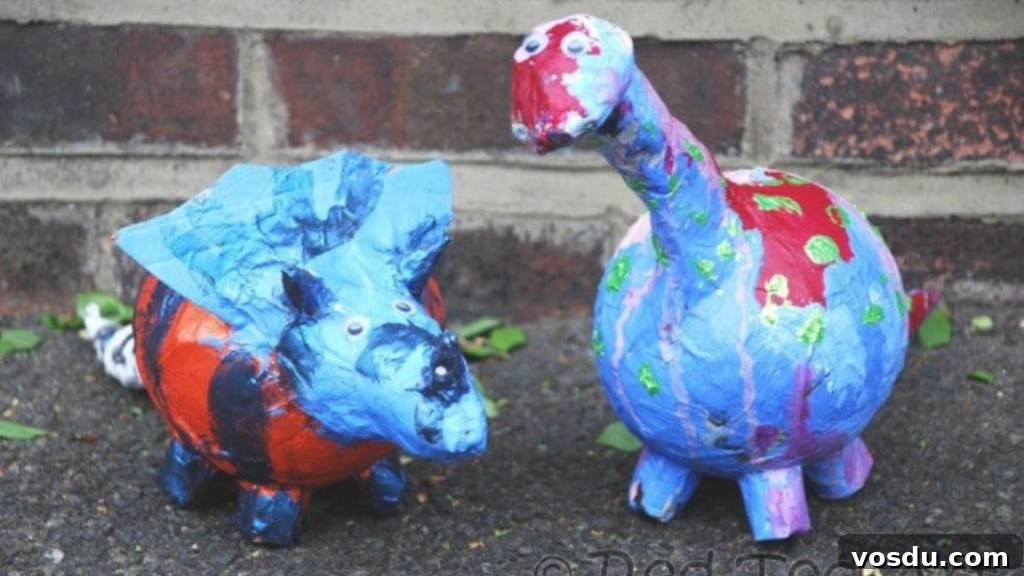 10 Creative DIY Piggy Banks You Can Make at Home 3 Blue and Red Paper Mache Dino Bank
