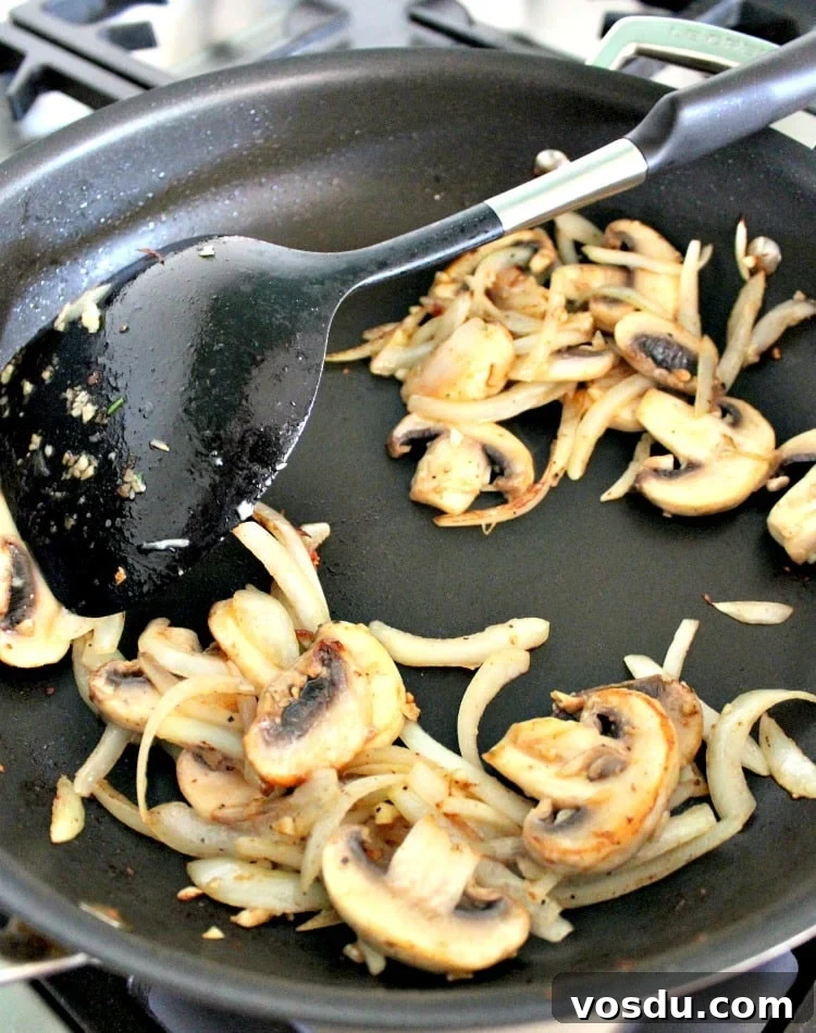 Creamy Chicken Stroganoff, sauteeing onions and mushrooms Creamy Chicken Stroganoff, sauteeing onions and mushrooms