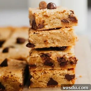 Brown Butter Blondies Made in One Bowl 12 A stack of 4 chocolate chip brown butter blondies.