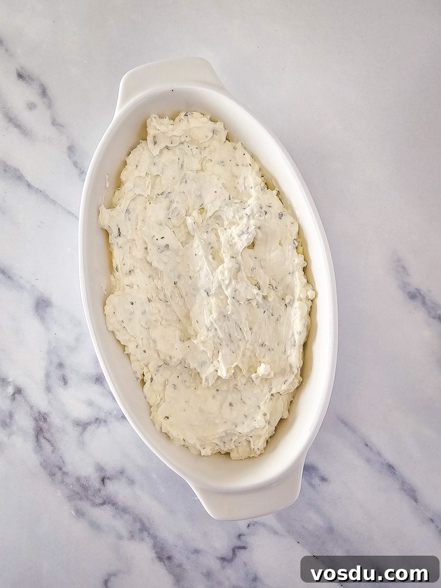 Cream cheese mixture for dip in white bowl.
