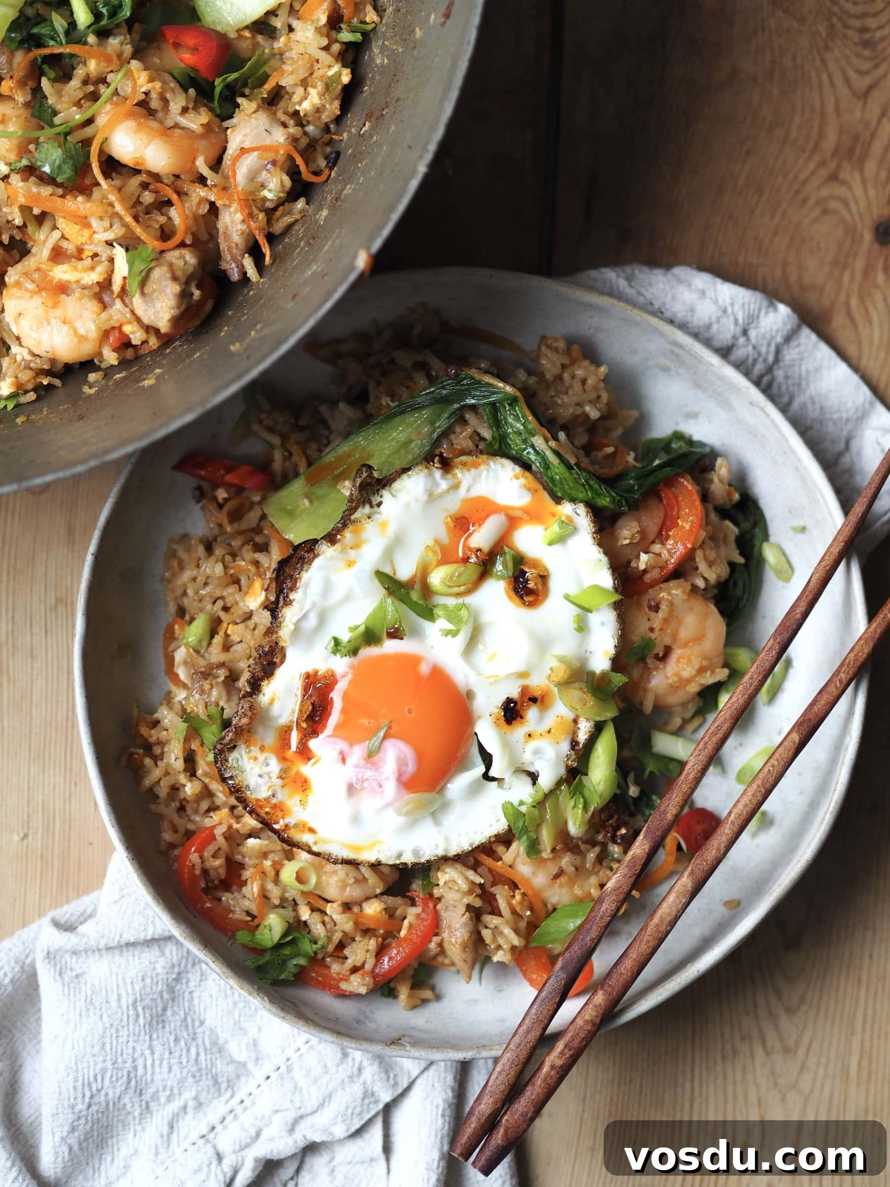 Shrimp and Chicken Fried Rice Recipe: Flavorful Weeknight Stir-Fry 2 Bowl of Shrimp and Chicken Fried Rice with fried egg