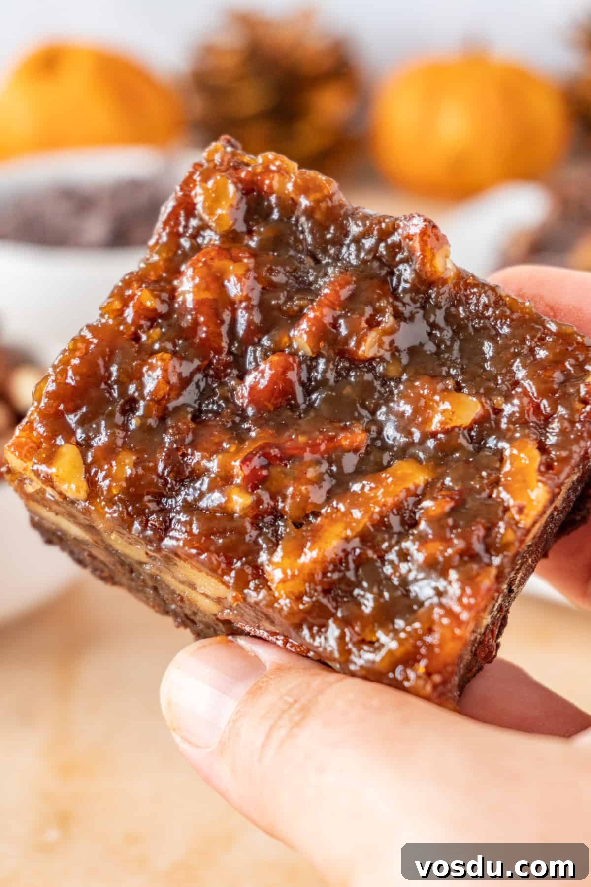 Showing the top of a Pecan Pie Brownie with its shiny, delicious pecan pie topping.