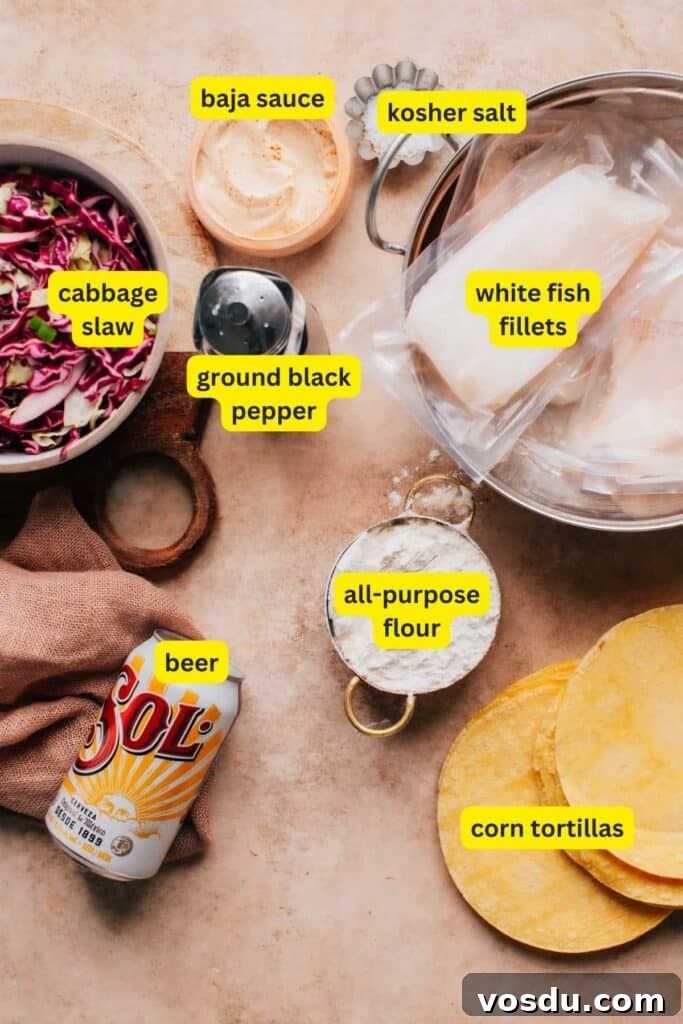 Ingredients for Baja fish tacos including Baja sauce, cabbage slaw, beer, all-purpose flour, corn tortillas, white fish fillets, kosher salt, and ground black pepper.