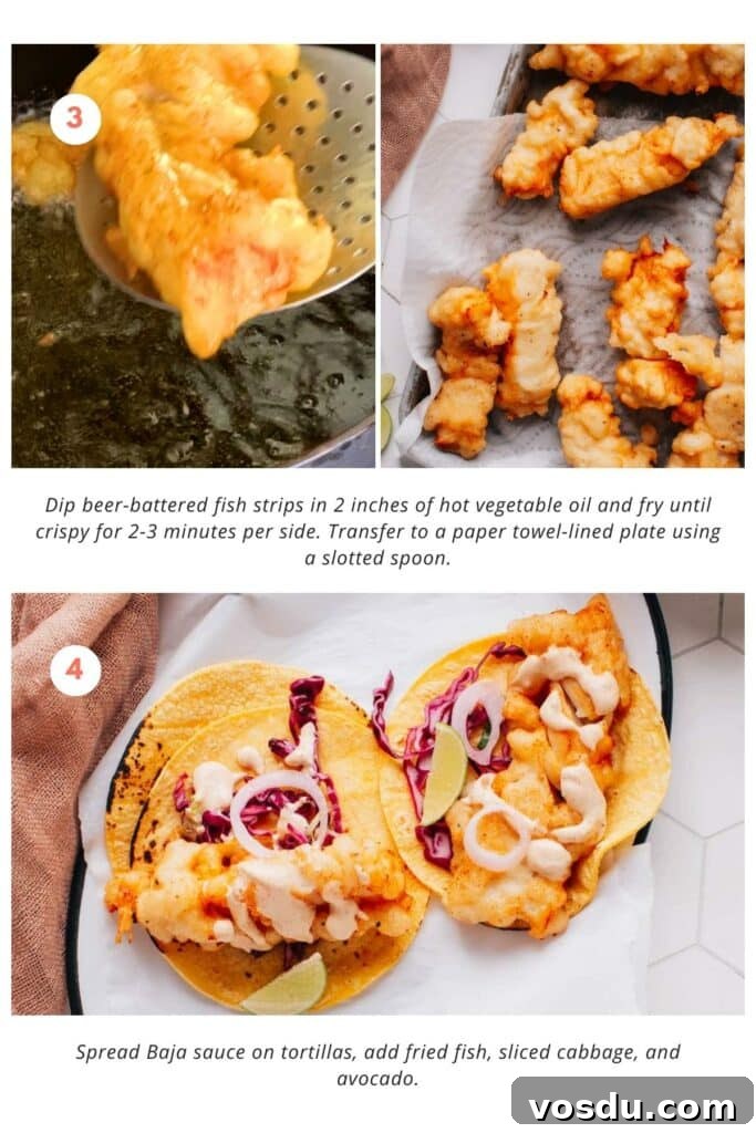 Beer-battered fish strips are dipped into 2 inches of hot vegetable oil and fried until crispy, about 2-3 minutes per side. They are then transferred to a paper towel-lined plate using a slotted spoon. Baja sauce is spread on tortillas, and fried fish, sliced cabbage, and avocado are added.