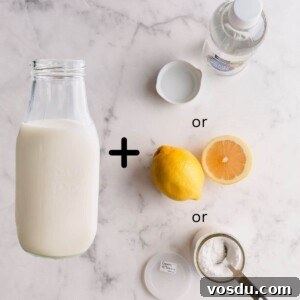 Bottle of milk with cream of tartar, white vinegar and lemon.