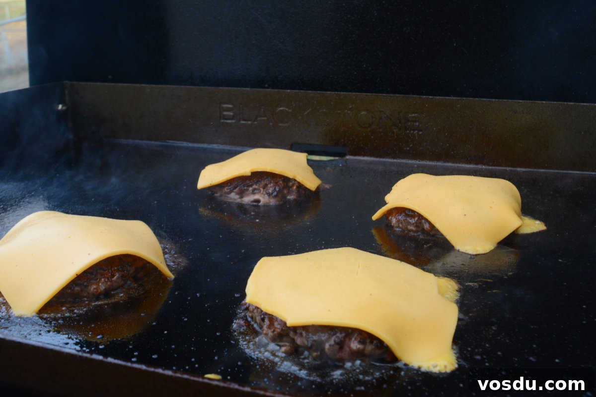 cheese melting on burger on blackstone grill