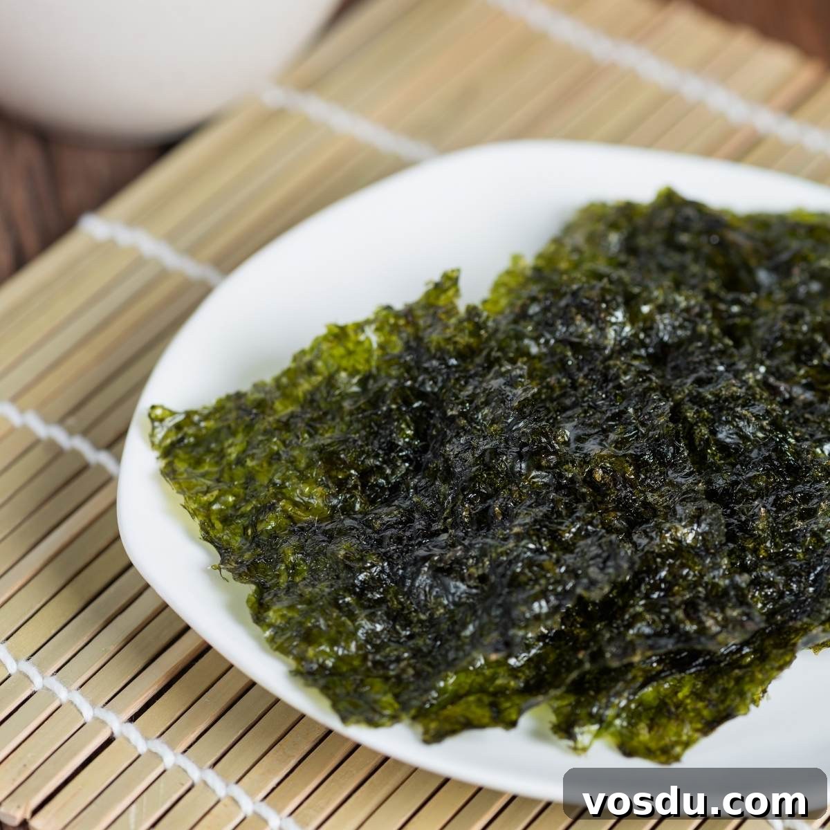 sheets of toasted nori on a white plate