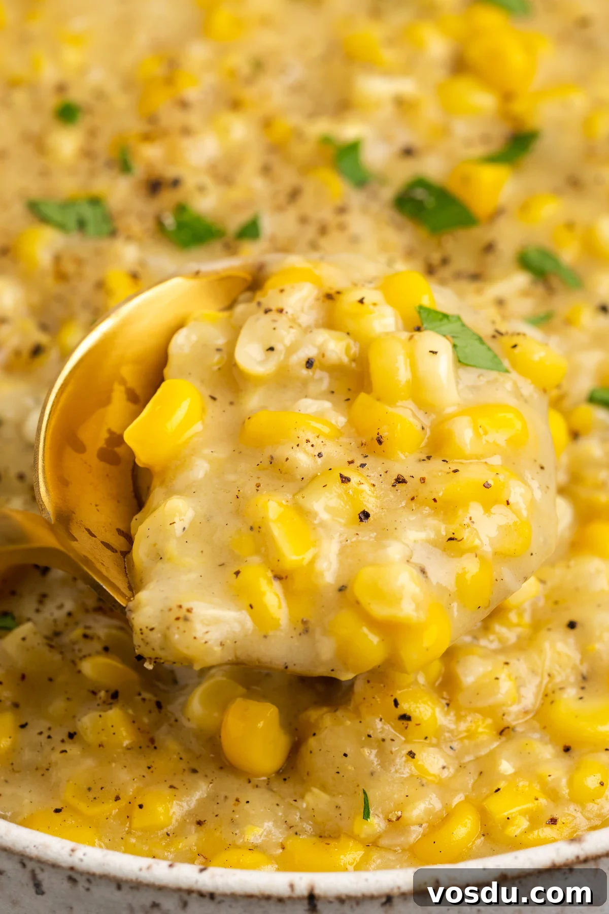 Spoonful of vegan creamed corn in bowl