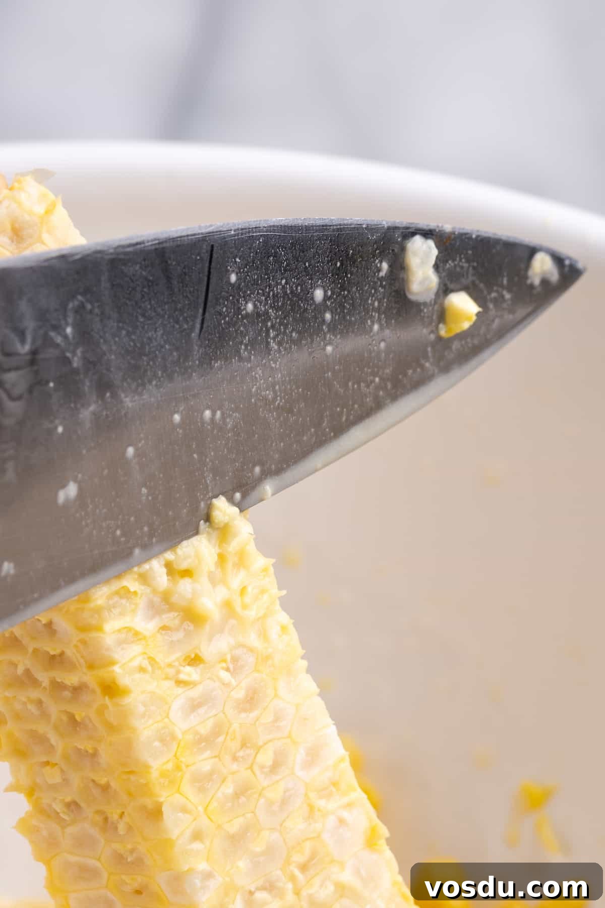 Knife milking ear of corn