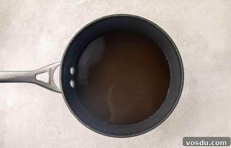 Broth and water in a silver pot