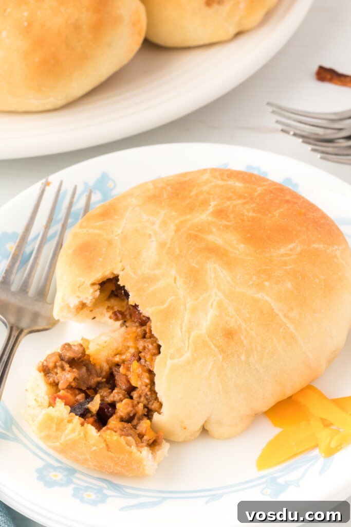 bbq bacon cheeseburger bun on plate with bite removed