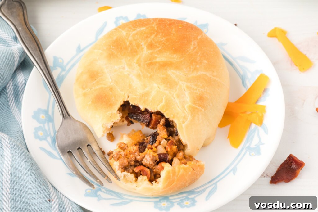 bbq bacon cheeseburger bun with bite removed to show the inside